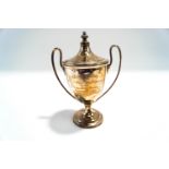 A silver two handled trophy cup and cover, by Walker & Hall, Sheffield 1933,