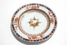 An 18th/19th century Chinese plate in the Imari palette, with central cartouche of a view,