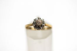 A 9 carat gold diamond cluster ring, the single cuts illusion set, finger size L1/2, 1.