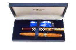 A Burberrys fountain pen, with 14K, 585 Medium nib, boxed, and a Mulberry fountain pen,