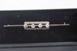 A four stone diamond bar brooch, the transitional cuts totalling approximately 0.48 carats, 6.