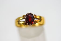 A 22 carat gold stone set ring, finger size Q, 4.