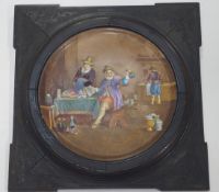 A Sarregumines pottery wall plaque painted with a scene after Teniers in an ebonised frame,