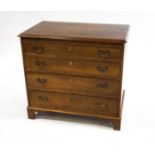 A George III mahogany chest with brushing slide and four drawers,