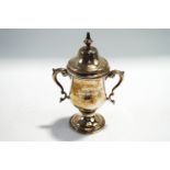 A small silver two handled trophy cup and cover, by Charles Edwards, London 1913,