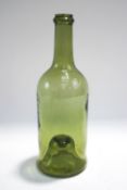 A 19th century green wine bottle, with inverted base,