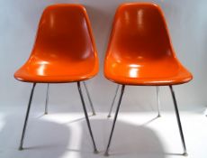 A pair of mid 20th century Herman Miller plastic fibreglass chairs,