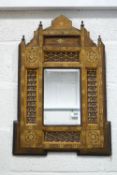 A decorative Moroccan style inlaid wall mirror,