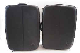A pair of Mulberry suitcases, with black leather trim, handles and logo label,
