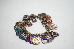 A silver bracelet, of solid curb links, with charms attached, 58.