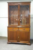 A George III mahogany bookcase the upper section with glazed and arch moulded doors,