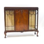 An Edwardian mahogany display cabinet, from Maples Antiques,