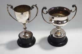 A plated two handled trophy cup plinth;