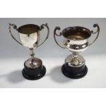 A plated two handled trophy cup plinth;