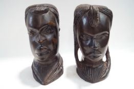 A pair of carved ebony African tribal heads, 28.