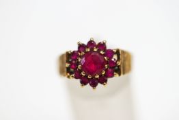 A 9 carat gold synthetic ruby cluster ring, finger size R1/2, 4.