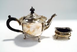 A silver teapot, by Mappin & Webb, Sheffield 1904; with a silver salt with pierced cape rim,