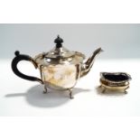 A silver teapot, by Mappin & Webb, Sheffield 1904; with a silver salt with pierced cape rim,