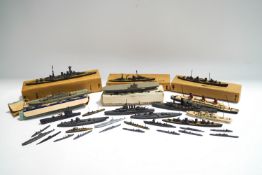 A quantity of cast waterline model ships and submarines