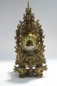 An impressive Victorian Gothic cast brass cased mantel clock, the two train movement by Japy Freres,