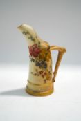 A Royal Worcester blush Ivory jug, with handpainted sprays of flowers and gilt highlights,