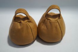 A pair of Mulberry leather doorstops,