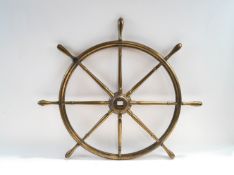A bronze Ship's wheel,