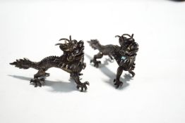 A pair of Chinese export silver dragon menu holders, by Wang Hing, stamped Latin makers mark,