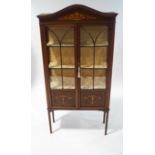 An Edwardian mahogany display cabinet, with painted Classical style decoration,