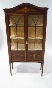 An Edwardian mahogany display cabinet, with painted Classical style decoration,