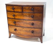 A 19th century mahogany bow fronted chest of two short over three long drawers,
