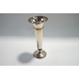 A loaded silver bud vase, London 1919, of usual plain trumpet form, 22.