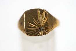 A 9 carat gold signet ring, set with a single cut diamond to one corner, fingers size T, 4.