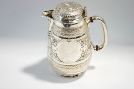 A Victorian silver hot water jug, by Fenton Brothers, Sheffield 1880, embossed in the Indian taste,