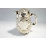 A Victorian silver hot water jug, by Fenton Brothers, Sheffield 1880, embossed in the Indian taste,