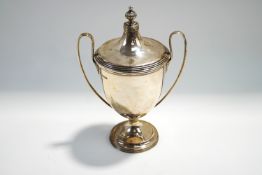 A silver two handled trophy cup and cover, Sheffield 1933,