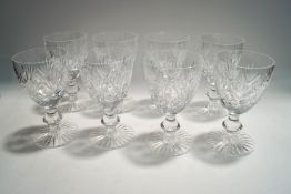 A set of eight cut glass wine glasses,