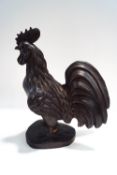 A carved ebony figure of a cockerel,