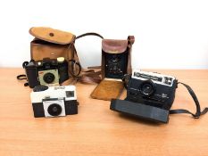 A Yoigtlander 'Brilliant' camera in leather case, and two Kodak 'Instamatic' cameras,