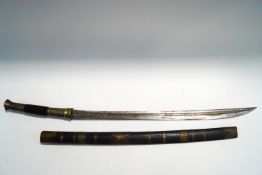 A Middle Eastern sword in bamboo scabbard with embossed metal mounts,