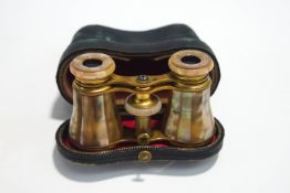 A pair of late 19th/early 20th century French mother of pearl opera glasses,