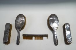 A pair of silver dressing table hair brushes; pair of clothes brushes;