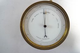 A brass cased circular marine barometer, 12.