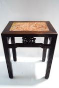 A Chinese hardwood table with red marble inset top,
