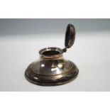 A loaded silver capstan shaped inkwell, Birmingham 1929, 9.