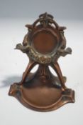 An Art Nouveau style copper plated ladies pocket watch stand, 10.