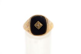 A 9 carat gold onyx and diamond set signet ring,