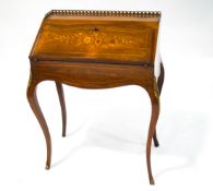 A 19th century rosewood Louis XVI style ladies writing desk with marquetry flowers to the fall