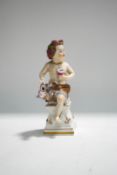 A 19th century German porcelain figure of Bachas seated on a plinth, moulded with musical trophies,
