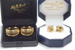 A pair of 9 carat gold earrings, of open work hoop design, cased; with a pair of knot ear studs,